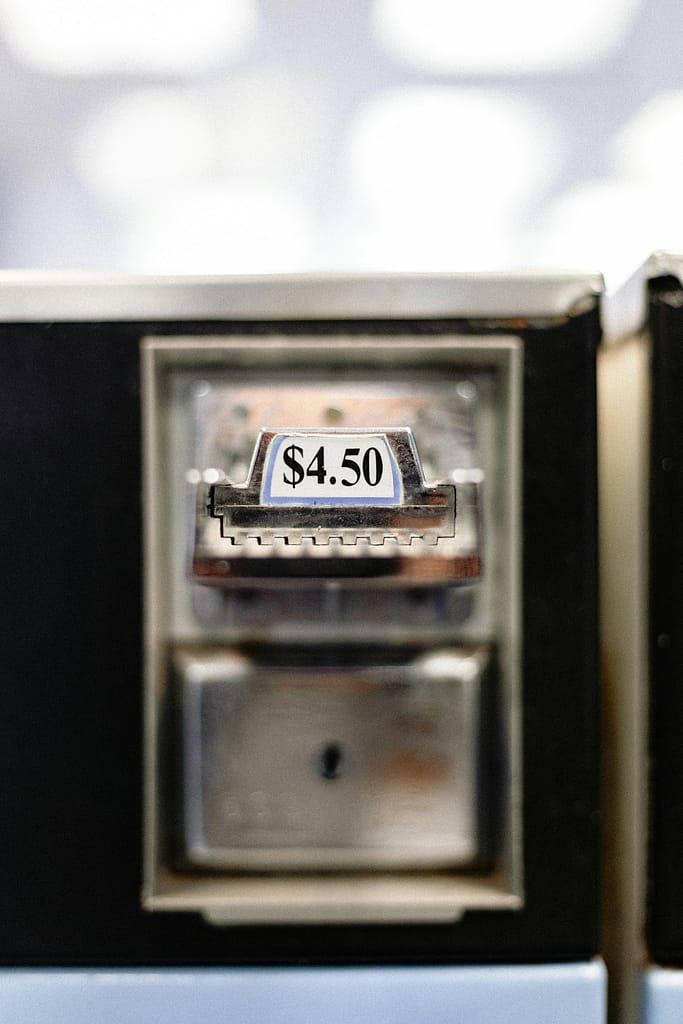 pexels-photo-3990307-3990307 Zoomed-in view of a $4.50 price label on a vending machine, indoor setting.